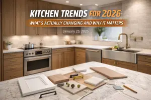Modern 2026 kitchen design with warm wood cabinets, subtle quartz countertops, workstation sink, and curated finish samples on island